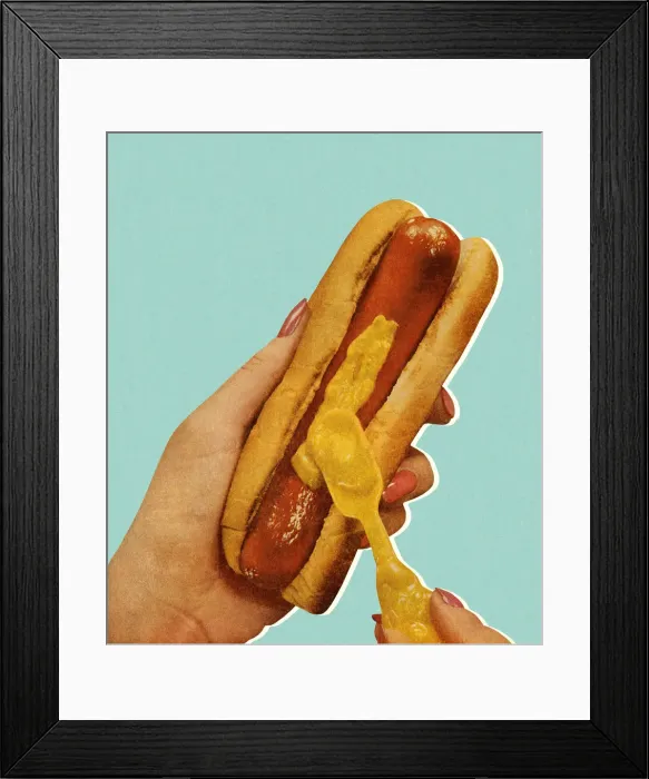 Framed Print : Spreading Mustard on a Hot Dog Framed Print : Spreading Mustard on a Hot Dog