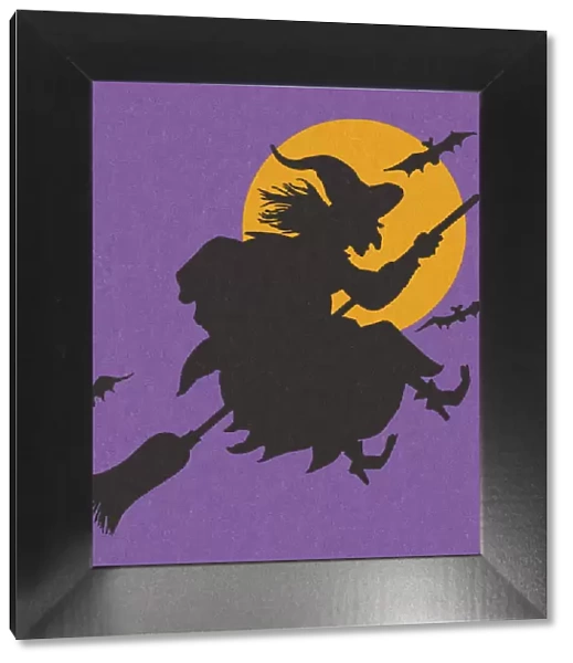 Silhouette of a Witch Flying on a Broomstick
