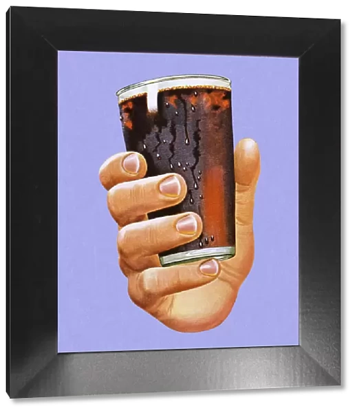 Hand Holding Glass of Cola