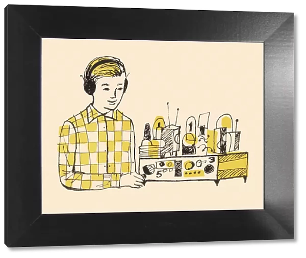 Boy Wearing Headphones and Using Radio