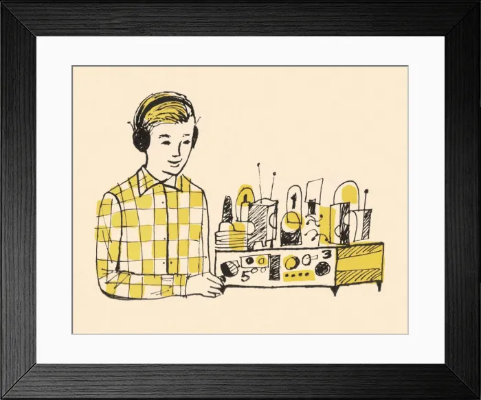 Framed Print : Boy Wearing Headphones and Using Radio Framed Print : Boy Wearing Headphones and Using Radio