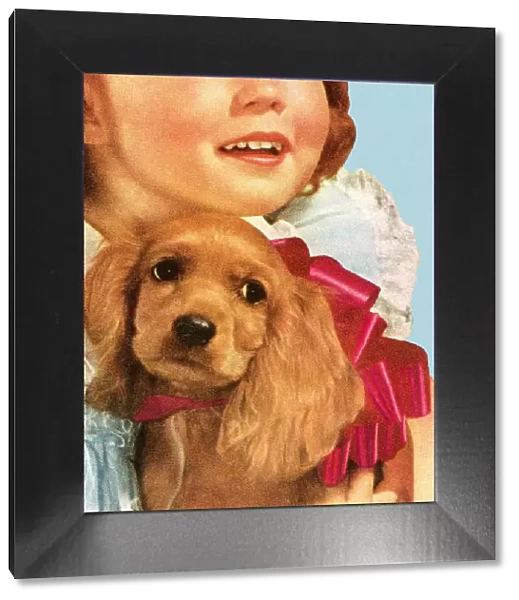 Girl Holding Cocker Spaniel Dog