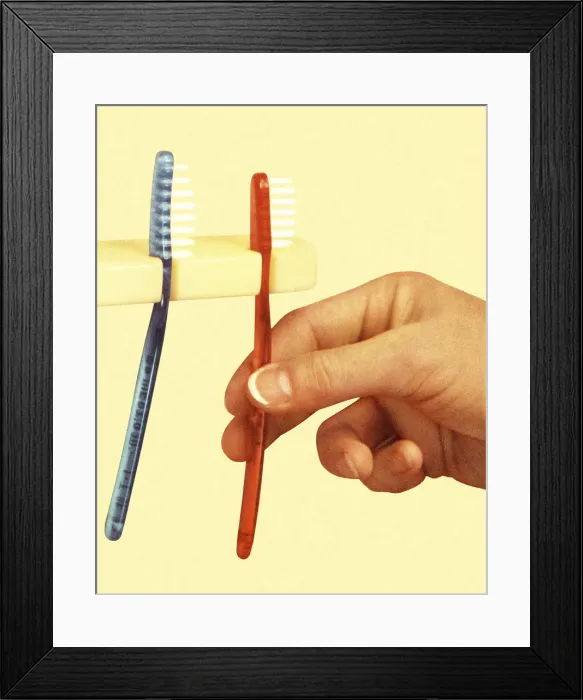 Framed Print : Hand and Two Toothbrushes Framed Print : Hand and Two Toothbrushes