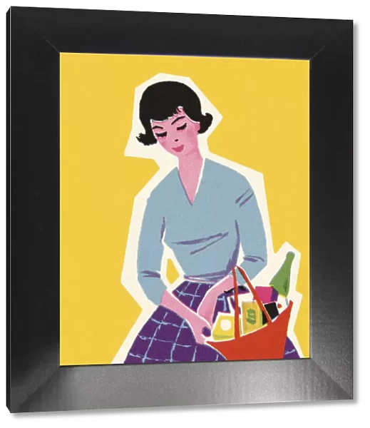 Woman Carrying a Basket Full of Products