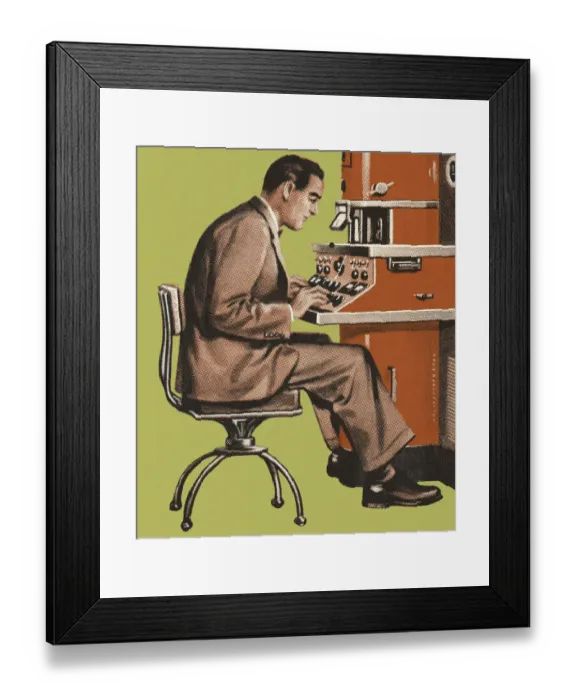 Framed Print : Man Working at a Control Panel
