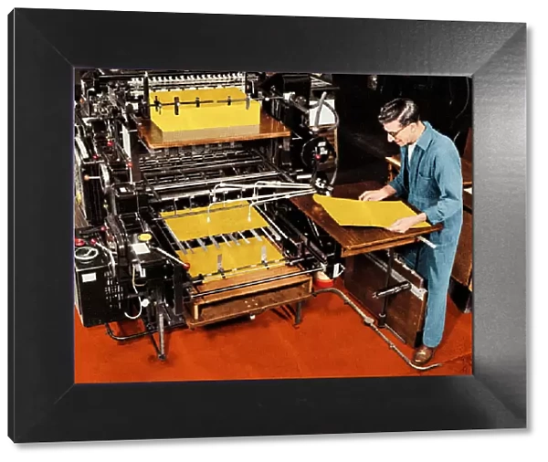 Man Working at a Printing Press