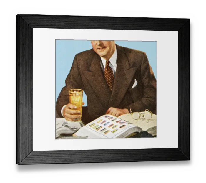 Framed Print : Man Reading And Holding a Drink Framed Print : Man Reading And Holding a Drink