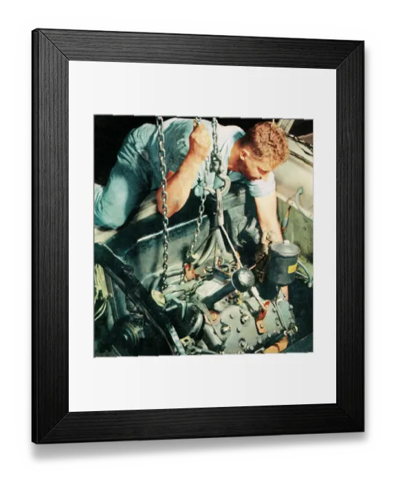 Framed Print : Man working on a car Framed Print : Man working on a car