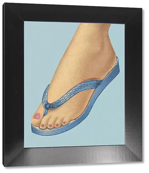 Womans Foot Wearing Flip Flop Shoe