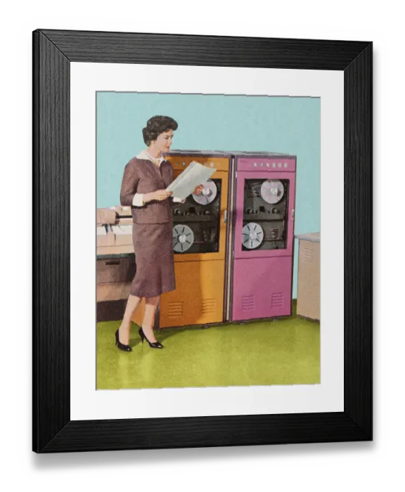 Framed Print : Woman Standing at Old Computers Framed Print : Woman Standing at Old Computers