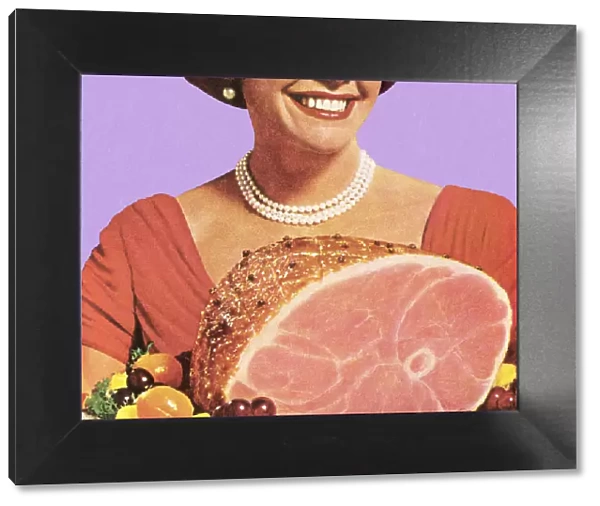 1950s housewife holding a ham dinner, smiling