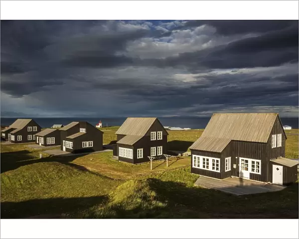 Cottages, cottage settlement in Hellnar, cloud formation, peninsula Snaefellsnes, West Iceland