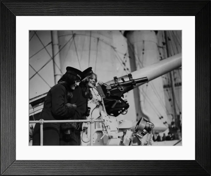 Framed Print : Naval Gun. 1929: Two women look at a gun on board HMS London Framed Print : Naval Gun. 1929: Two women look at a gun on board HMS London