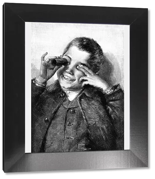 Victorian boy laughing as he looks through a kaleidescope