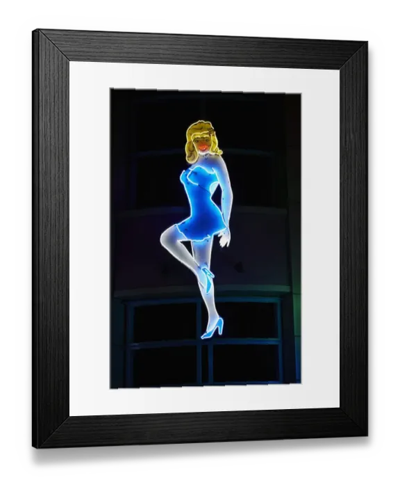 Framed Print : Neon sign of woman illuminated at night