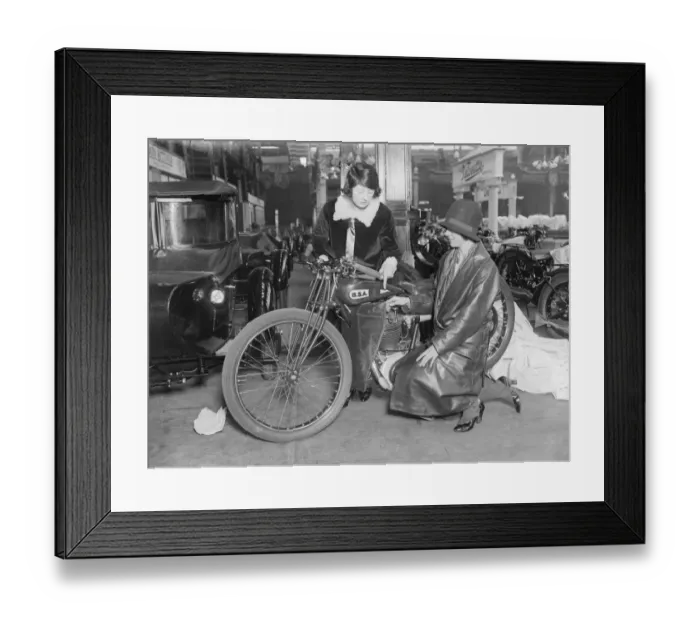 Framed Print : Bike Show. October 1928: Billy Painter examining a BSA motorcycle at the Framed Print : Bike Show. October 1928: Billy Painter examining a BSA motorcycle at the
