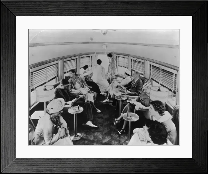Framed Print : Club Car. A group of passengers lounge in a trains cone-shaped club car Framed Print : Club Car. A group of passengers lounge in a trains cone-shaped club car