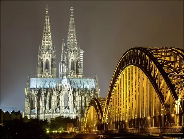 The illuminated Cologne Cathedral and Hohenzollern Bridge at night, Deutz, Cologne