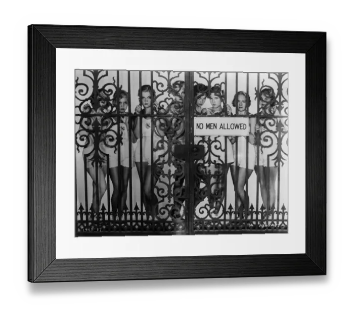 Framed Print : Fed Up. circa 1930: During filming in Hollywood girls pose behind wrought Framed Print : Fed Up. circa 1930: During filming in Hollywood girls pose behind wrought