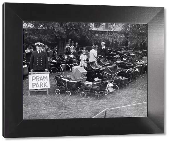 Pram Park. circa 1930: A stretch of grass, being used by mothers as a pram park