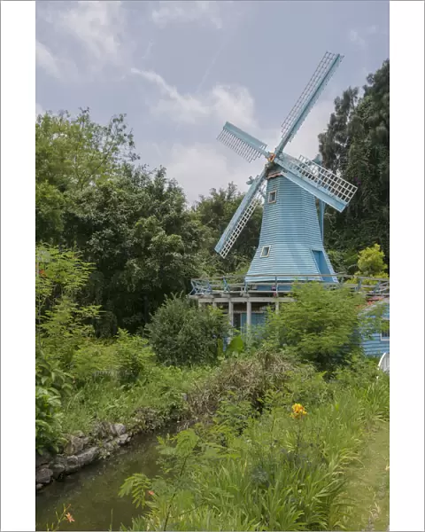 Blue Windmill in a Gordon with River against Blue Sky
