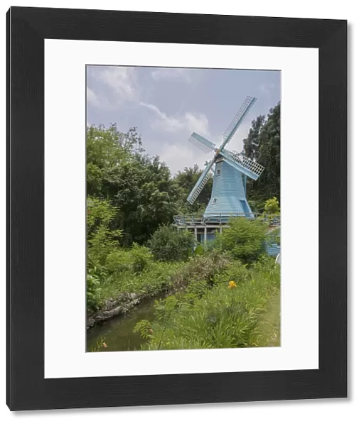 Blue Windmill in a Gordon with River against Blue Sky