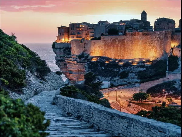 Bonifacio, Corsica, France. Sunset over cliffs and town