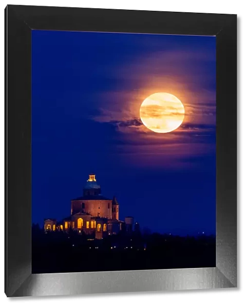 Full super moon rising over San Luca Sanctuary, Bologna, Italy