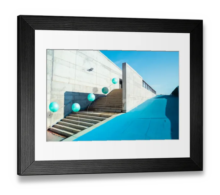 Framed Print : Poetic stop motion picture of green balloons following each other going up on stairs in a Framed Print : Poetic stop motion picture of green balloons following each other going up on stairs in a