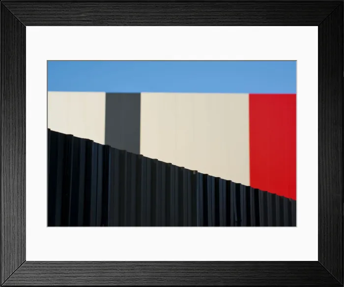 Framed Print : Metallic fence against modern colorful wall Framed Print : Metallic fence against modern colorful wall