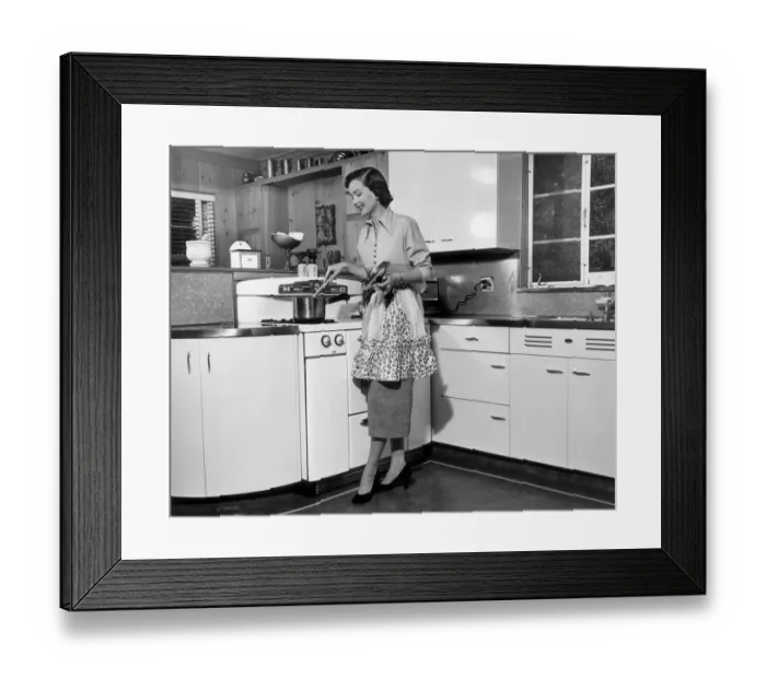 Framed Print : Woman stirring pot at stove Framed Print : Woman stirring pot at stove
