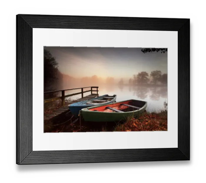 Framed Print : Rowing boats moored on banks of wooded lake Framed Print : Rowing boats moored on banks of wooded lake