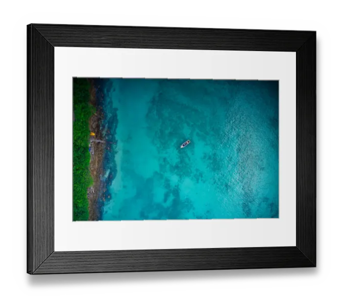 Framed Print : Aerial view of boat on crystal clear water in Phi Phi Island, Krabi, Thailand Framed Print : Aerial view of boat on crystal clear water in Phi Phi Island, Krabi, Thailand