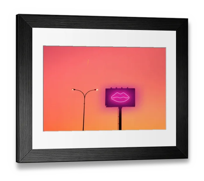 Framed Print : Billboard with sexy lips neon light and sunset sky in the city Framed Print : Billboard with sexy lips neon light and sunset sky in the city