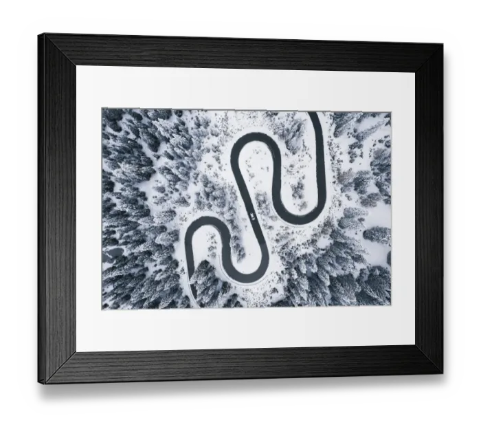 Framed Print : Aerial view of winding road in winter forest Framed Print : Aerial view of winding road in winter forest