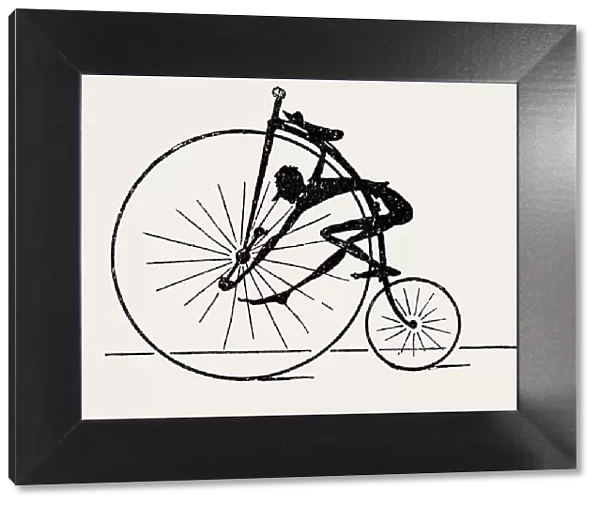 Penny farthing bicyclist, silhouette, side view on white background