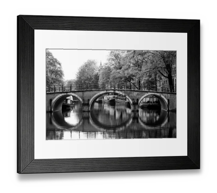 Framed Print : Typical arch bridge in Amsterdam in black and white Framed Print : Typical arch bridge in Amsterdam in black and white