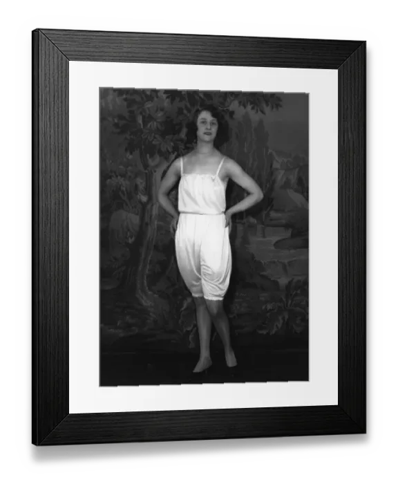 Framed Print : Underwear. circa 1928: A woman models underwear, against a painted back-drop Framed Print : Underwear. circa 1928: A woman models underwear, against a painted back-drop
