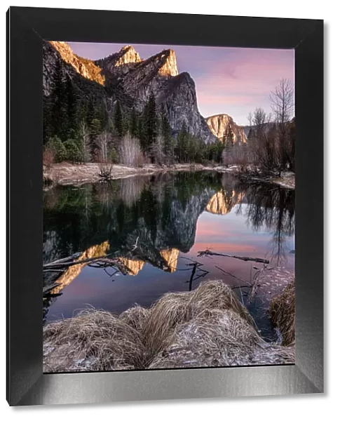 Three Brothers Mountain in Yosemite National Park at Sunrise Reflected in the Merced