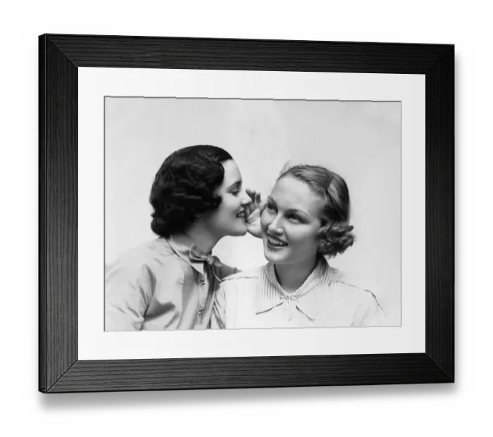 Framed Print : Two Smiling Women The 1 Wearing The Blouse With A Bowtie Is Wispering A Secret In The Ear Framed Print : Two Smiling Women The 1 Wearing The Blouse With A Bowtie Is Wispering A Secret In The Ear