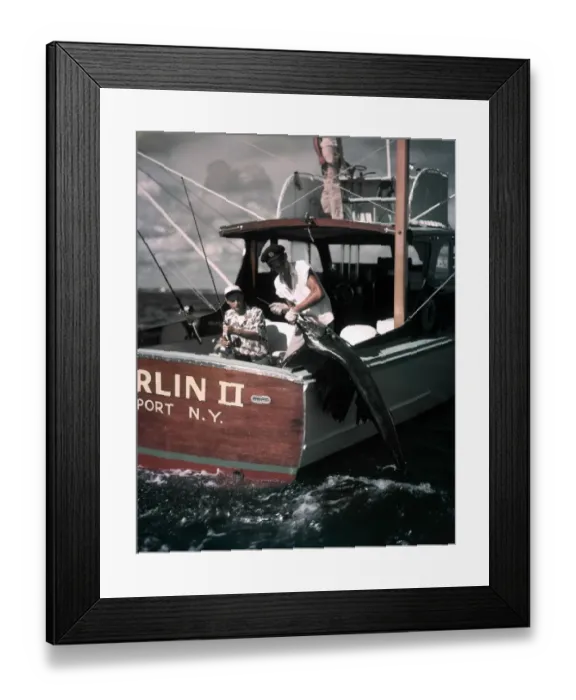 Framed Print : Deep Sea Fishing Boat Man At Helm Two Men On Stern One Hold Rod Reel One Pulls Fish Framed Print : Deep Sea Fishing Boat Man At Helm Two Men On Stern One Hold Rod Reel One Pulls Fish
