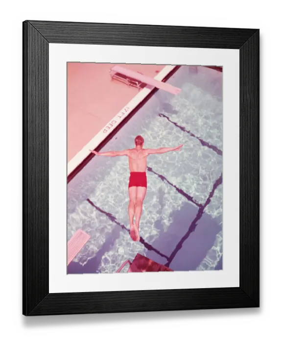 Framed Print : Man diving into swimming pool, overhead view. (Photo by H Framed Print : Man diving into swimming pool, overhead view. (Photo by H