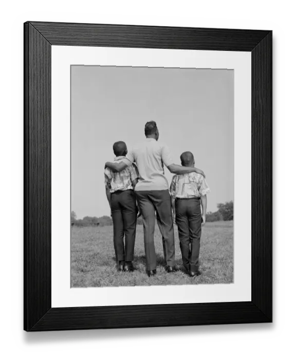 Framed Print : African-American father with arms around two sons, rear view Framed Print : African-American father with arms around two sons, rear view