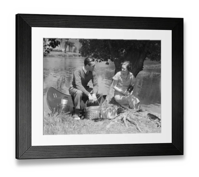 Framed Print : Couple Young Man Woman Smiling In Front Of Canoe With Picnic Basket Thermos Man Sweater Framed Print : Couple Young Man Woman Smiling In Front Of Canoe With Picnic Basket Thermos Man Sweater