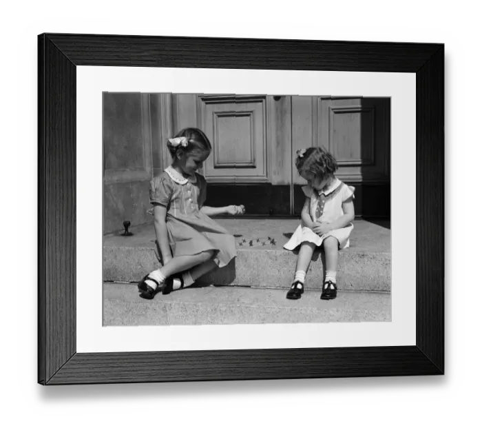 Framed Print : Girls sitting on steps outdoors, playing jacks Framed Print : Girls sitting on steps outdoors, playing jacks
