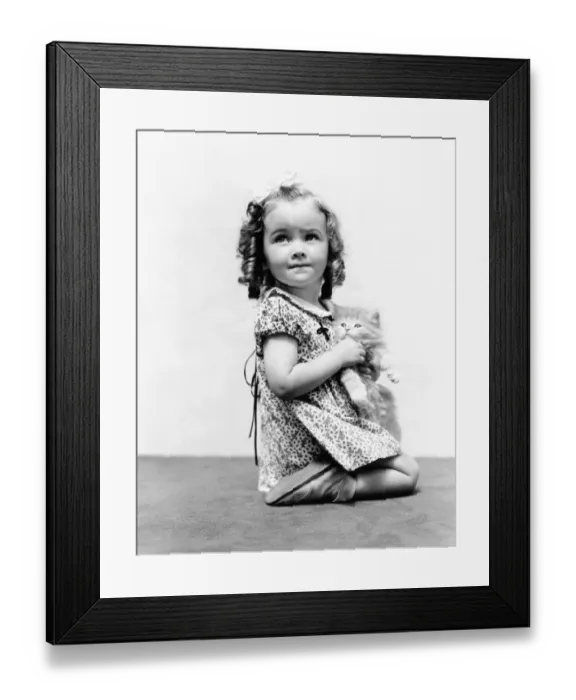 Framed Print : Girl with long curly hair, holding Persian kitten Framed Print : Girl with long curly hair, holding Persian kitten