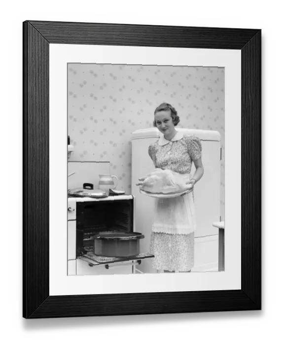 Framed Print : Woman Wearing An Apron Over A White Collar Cotton Print Dress Is Standing In Front Of An Framed Print : Woman Wearing An Apron Over A White Collar Cotton Print Dress Is Standing In Front Of An