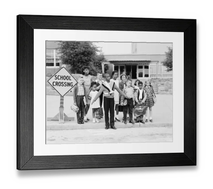 Framed Print : Boy safety guard with students at school crossing curb Framed Print : Boy safety guard with students at school crossing curb