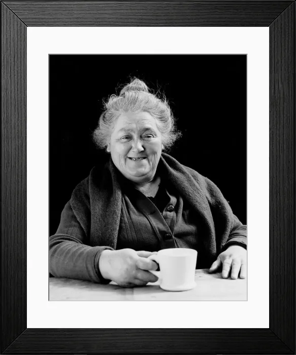 Framed Print : Elderly woman smiling, holding coffee cup, portrait Framed Print : Elderly woman smiling, holding coffee cup, portrait