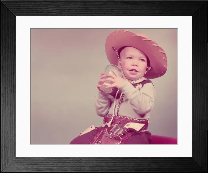 Framed Print : Toddler boy dressed as cowboy, drinking glass of milk. (Photo by H Framed Print : Toddler boy dressed as cowboy, drinking glass of milk. (Photo by H